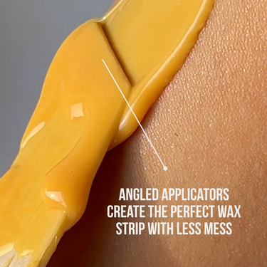 Crybaby Wax hard wax applied to skin with an angled Get a Grip applicator for a clean wax strip
