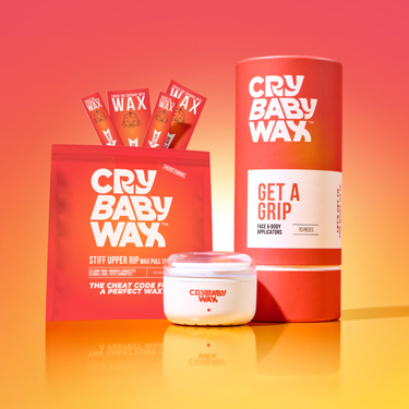 Stiff Upper Rip wax pull tabs paired with Crybaby vegan hard wax for at-home face and body waxing on sensitive skin